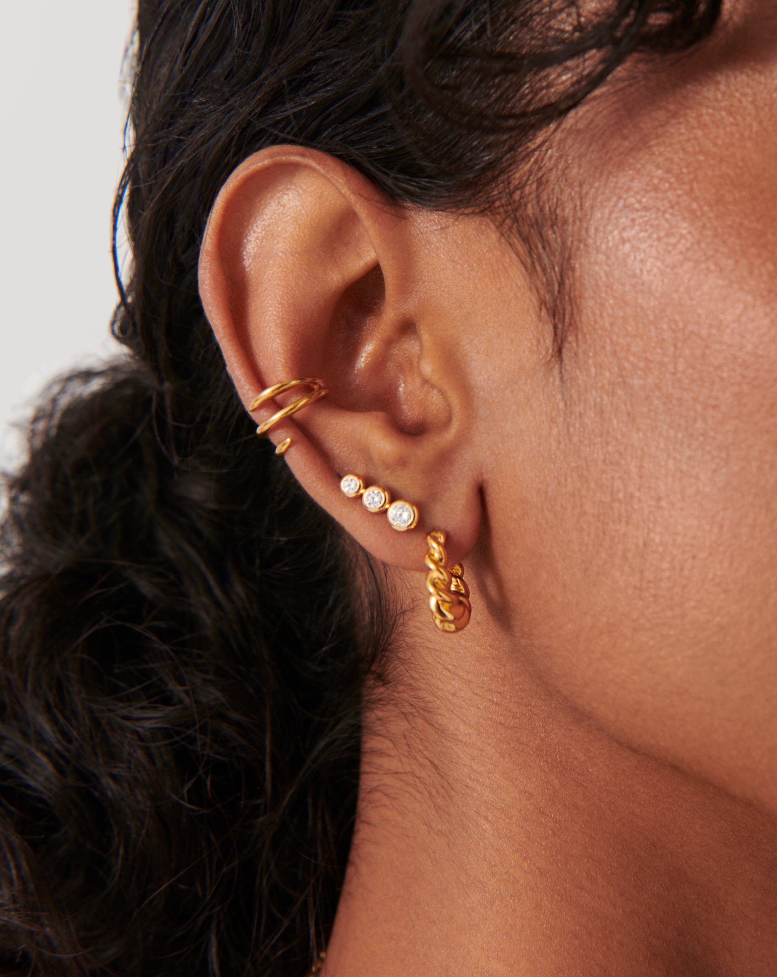 Gold stone shop stud earrings