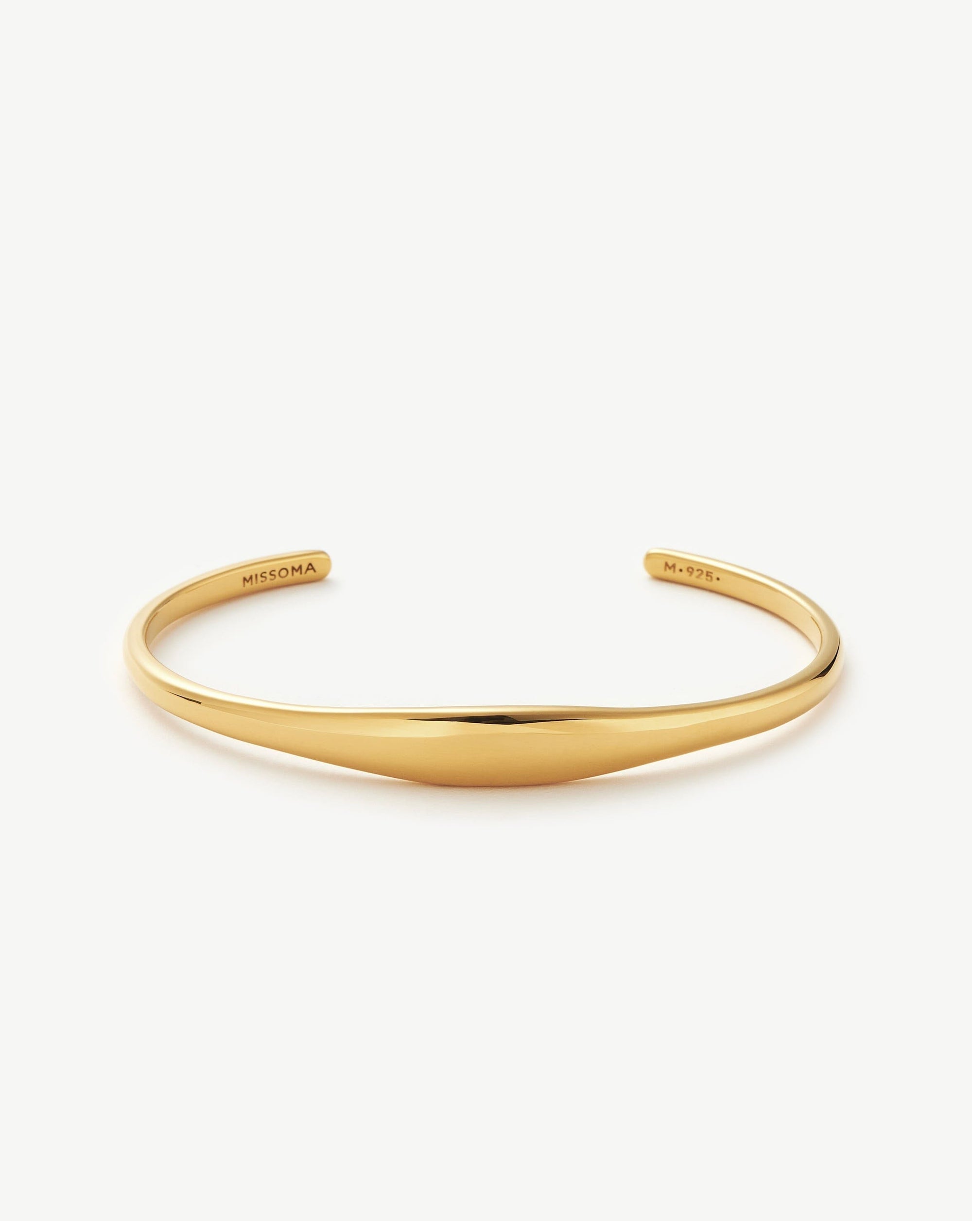 Keep it classic with this Missoma cuff bracelet. Whether you're shopping for yourself or looking for the perfect gift, this versatile gold cuff is a wardrobe essential. Available in two sizes, style solo or pair with a double chain for an instant arm stack.

